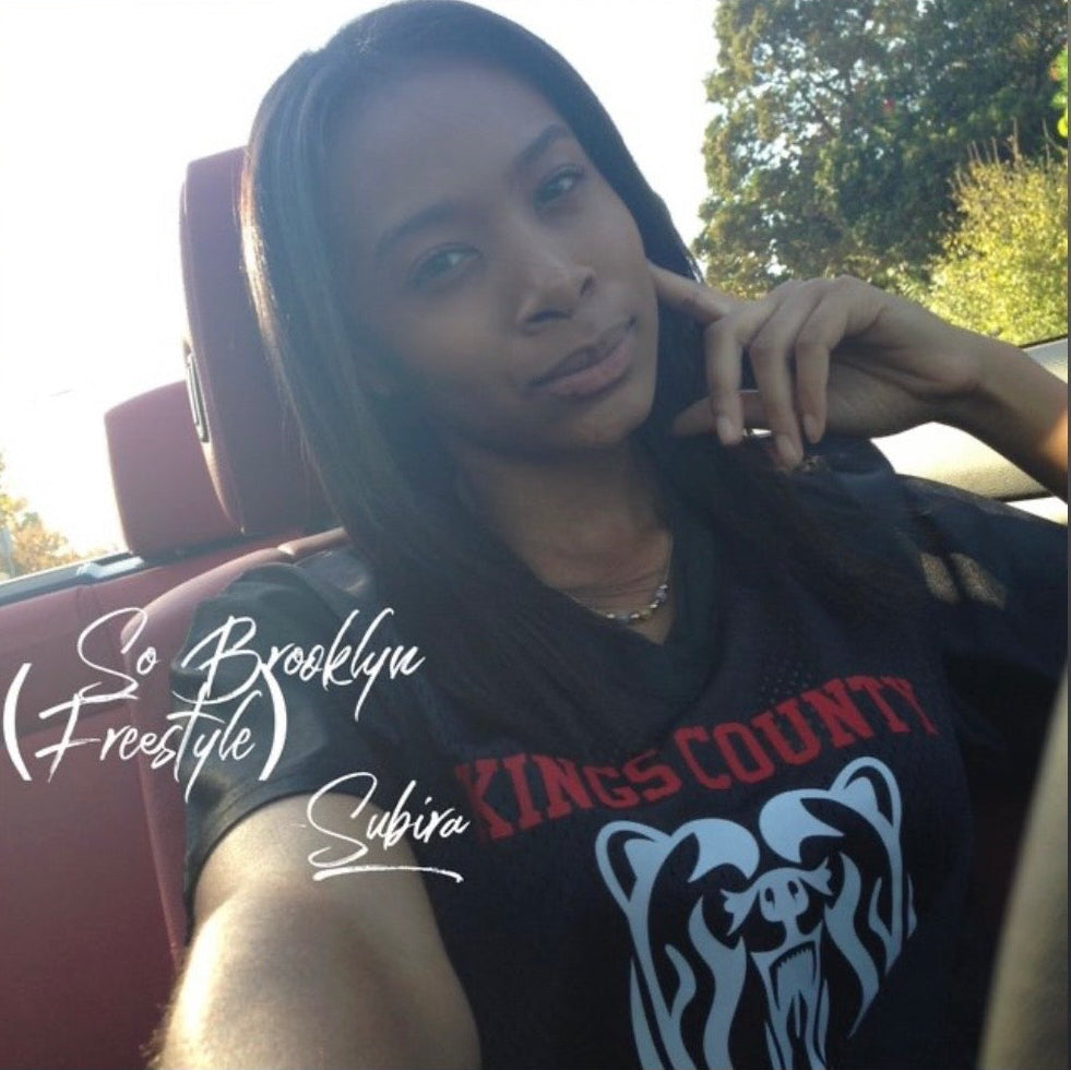 Cover art showing a song by Subira wearing a black t-shirt repping Kings County of Brooklyn, NY.
